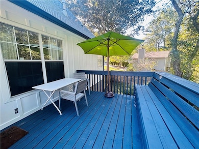 Wooden terrace featuring outdoor dining area