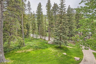 View from deck-creek and bridge to club
