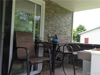 Patio covered back porch with sliding glass door o