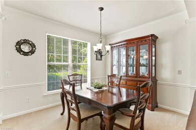 Dining room with chair railing and crown molding
