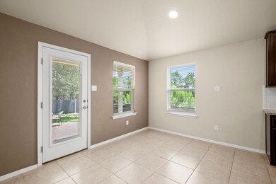 Unfurnished dining area featuring lofted ceiling 