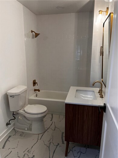 Bathroom featuring bathtub / shower combination, v