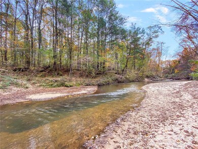 The property includes this gorgeous sandy beach to