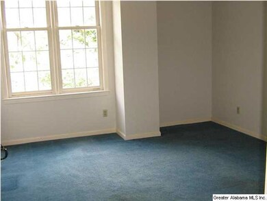 Guest bedroom has a great wooded view