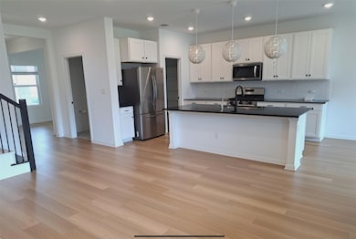 Kitchen featuring appliances with stainless steel