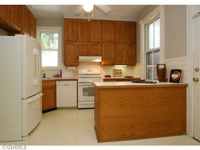 Kitchen - Kitchen with ample wooden cabinetry and 