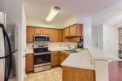 Kitchen featuring appliances with stainless steel