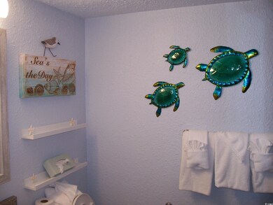 Bathroom featuring a textured ceiling