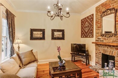 Decorative brick fireplace & crown molding.