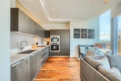 Kitchen featuring a sink, modern cabinets, light 