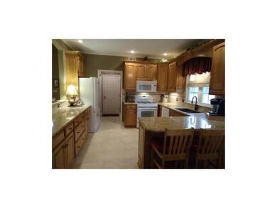 Open Kitchen with granite counter tops, service ar