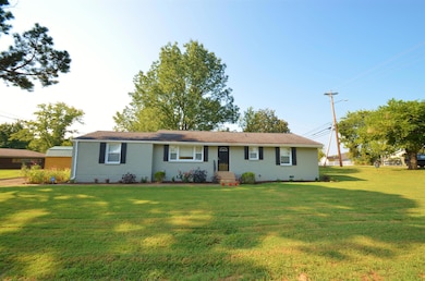 All Brick Home With Neatly Manicured Lawn