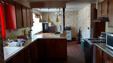 Spacious kitchen with breakfast bar and large dini