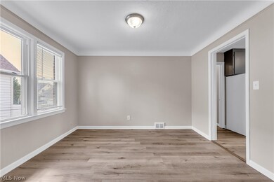 Unfurnished room with hardwood / wood-style flooring