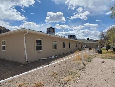 Back of house featuring stucco siding