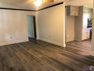 Wood looking vinyl flooring in the Den or Formal D