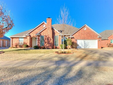 Ranch-style house with a garage and a front yard