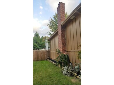 Nice brick fireplace and landscaping. Large gate t