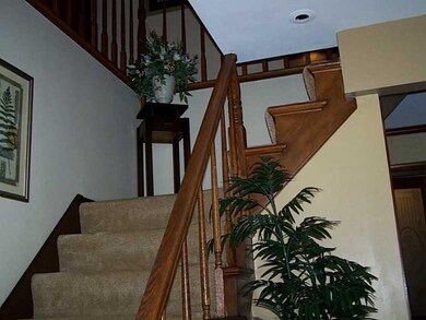 Entry/Foyer. LOVELY WOD BANISTER AND HARDWOOD FLOO