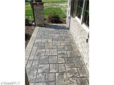 Exterior Front. stamped concrete front porch