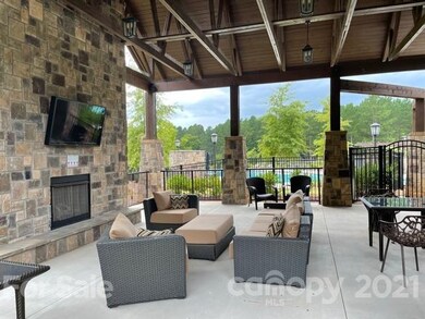 Relax by the outside fireplace.