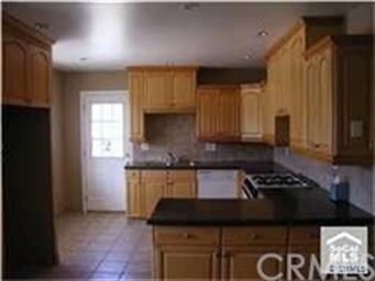 Another view into kitchen with lots of windows and