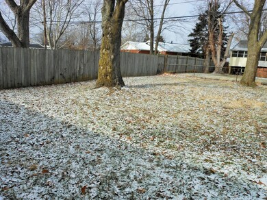 Large, partially fenced yard
