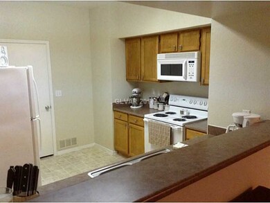 Kitchen. LOOKING IN FROM DINING ROOM/BREAKFAST BAR