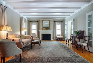 Stunning formal living room with beamed ceiling an