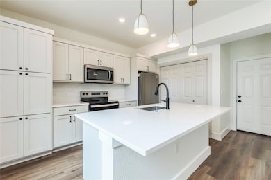 Kitchen featuring stainless steel appliances, a s