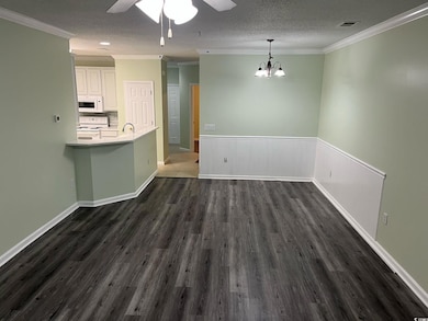 Unfurnished dining area with a sink, a textured ce
