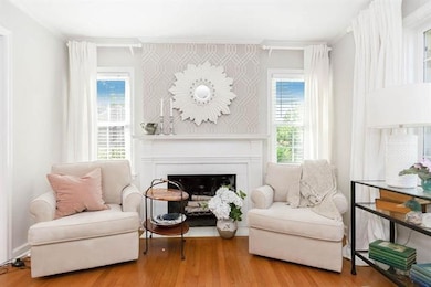 Family room with hardwood floors and fireplace.
