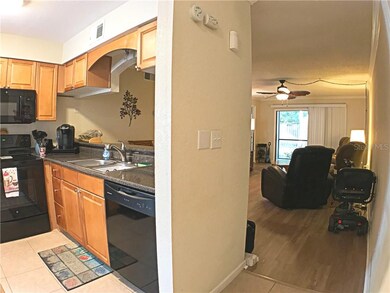 Entrance way to unit with view of Kitchen, lving r