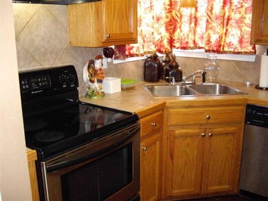 Close up of smooth top stainless steel stove and c