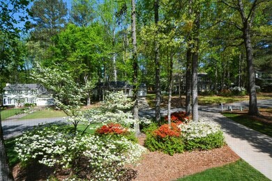 View of home's community featuring view of wooded area