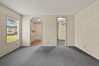 The spacious primary bedroom boasts a walk-in closet and a pretty en-suite bathroom—perfect for relaxing and unwinding at the end of the day.