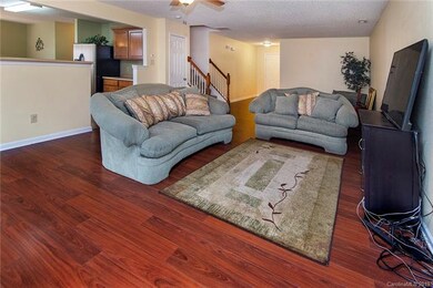 Living room with entrance to kitchen.
