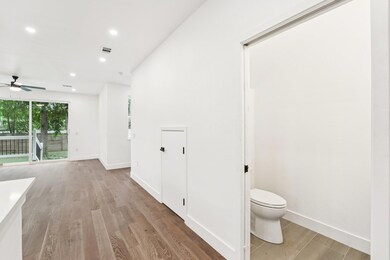 Bathroom with ceiling fan, wood finished floors, 