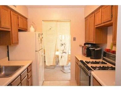Kitchen. Galley kitchen has plenty of cabinets and
