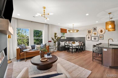 *Photo is the same floorplan or a model home and used for example purposes only.  Some options may be different in this inventory home., recessed lighting, and a glass covered fireplace