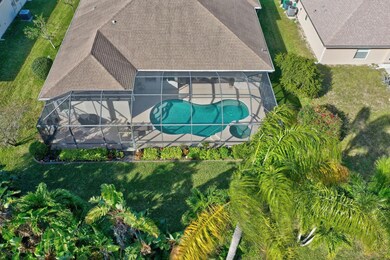 Aerial shot of Pool, screened porch and private ba