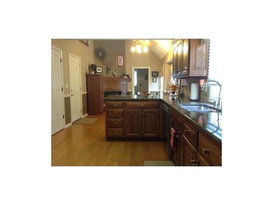 Updated kitchen with SS, granite, travertine backs