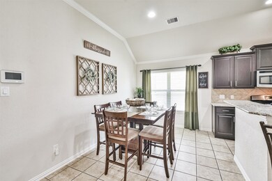 Dining area open to kitchen and family room