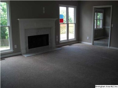 The main level den has new carpet and a marble sur