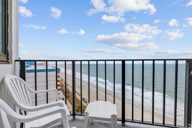 Balcony with a beach view and a water view