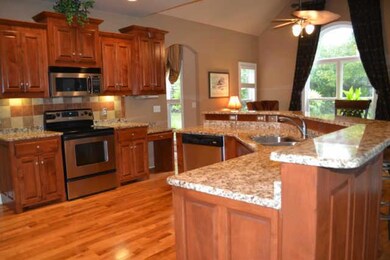 14 X 14 EAT IN KITCHEN WITH KEEPING ROOM, HARDWOOD, GRANITE, CUSTOM CABINETS & BAR