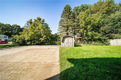 View of yard with a storage unit