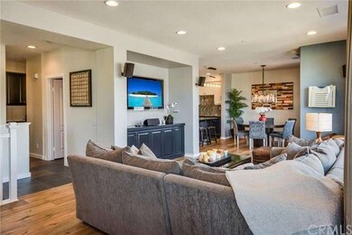 Wide-plank wood floors run through LR, DR, all BRs