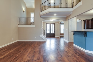 Entryway with ornamental molding, a towering ceili