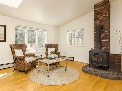 Cozy den area off kitchen with wood...